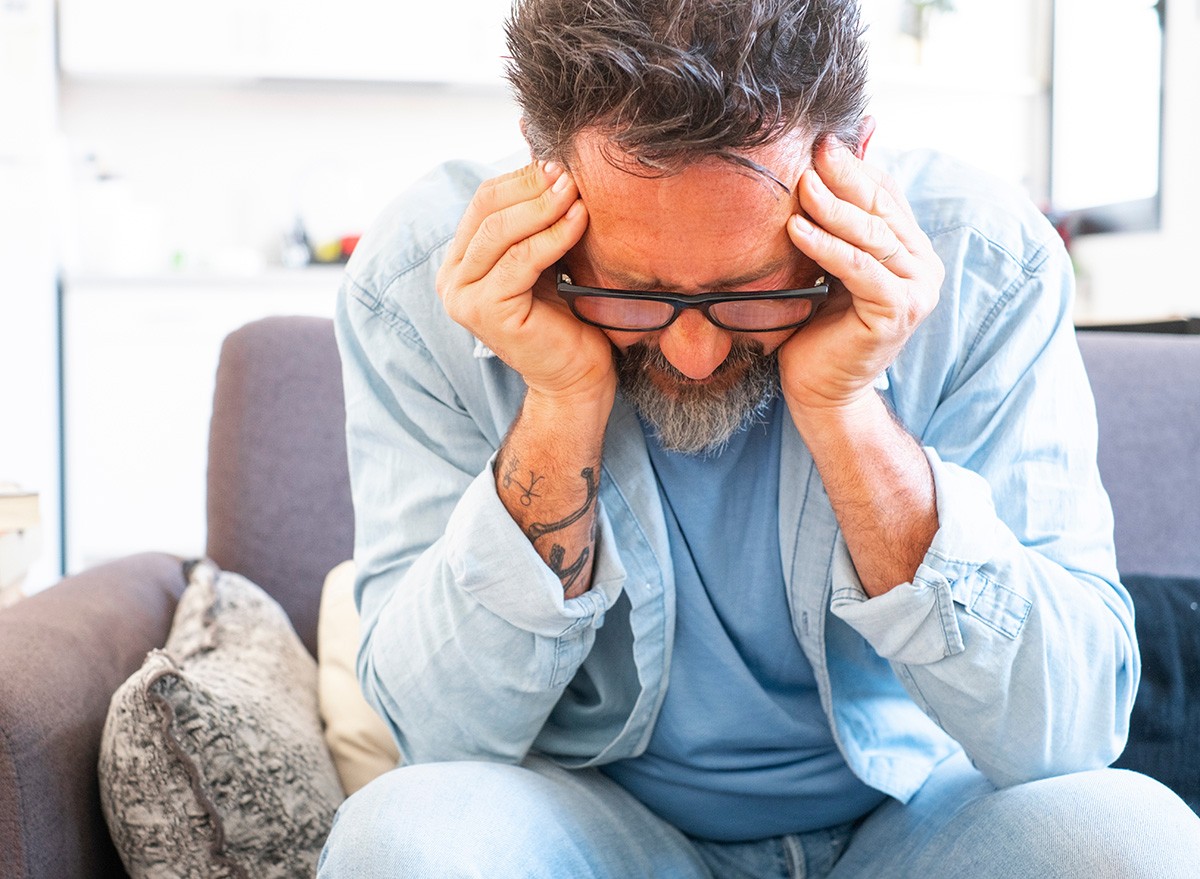 man-with-his-head-in-his-hands-experiencing-stress