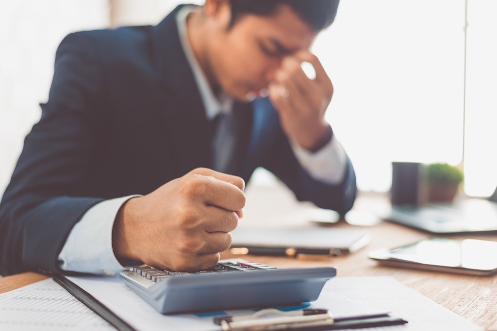 man-feeling-stress-while-working-in-an-office