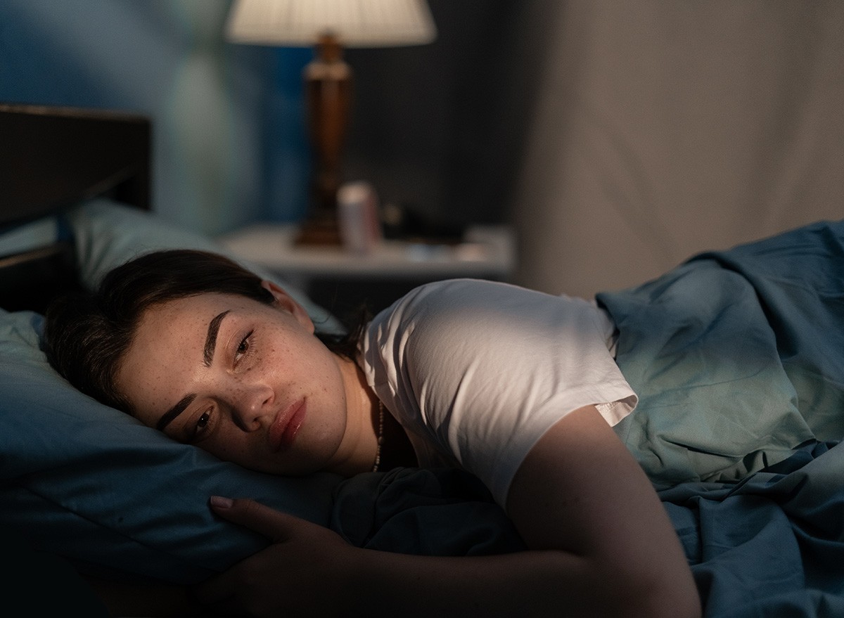 woman-in-bed-looking-sad
