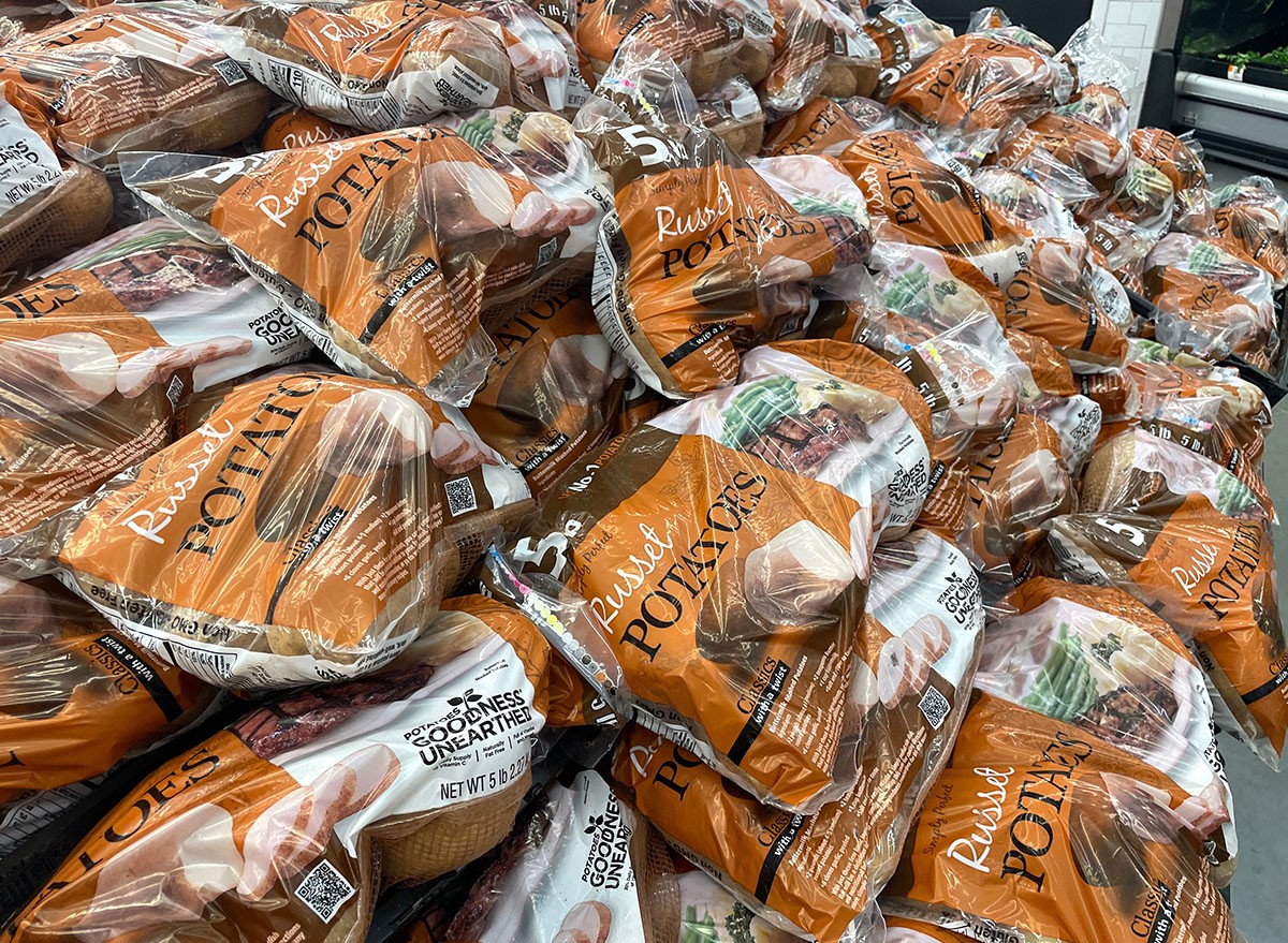 Bags of potatoes at the grocery store.