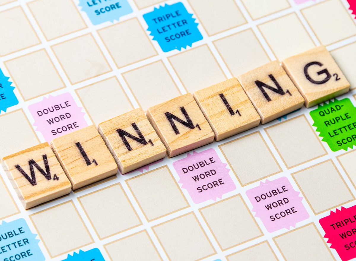 The word 'winning' spelled out on a Scrabble board