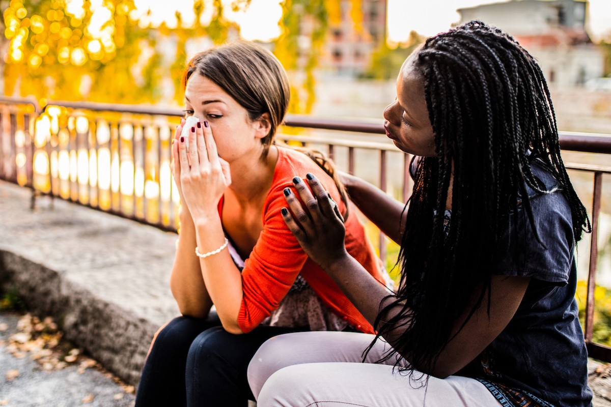 Friend reassuring sad friend