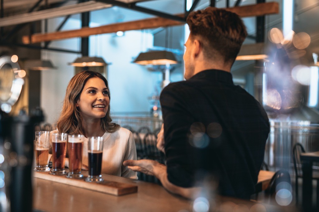 A happy couple on date nights at a brewery