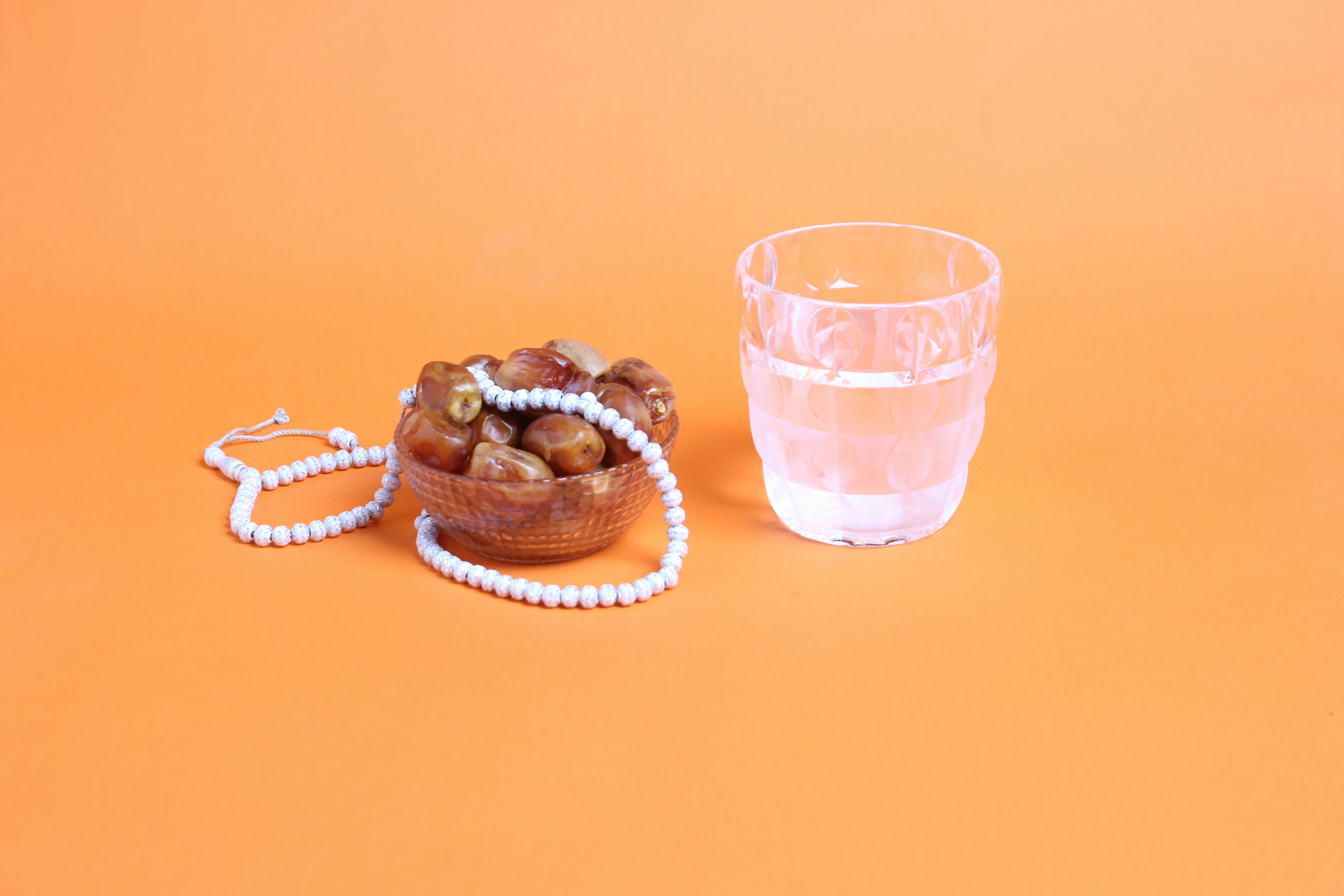 dates with water and prayer beads to break the fast