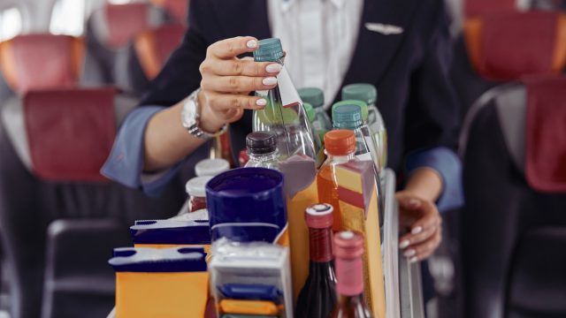Flight Attendants Say Never Drink These 2 Beverages on a Plane—Here’s Why