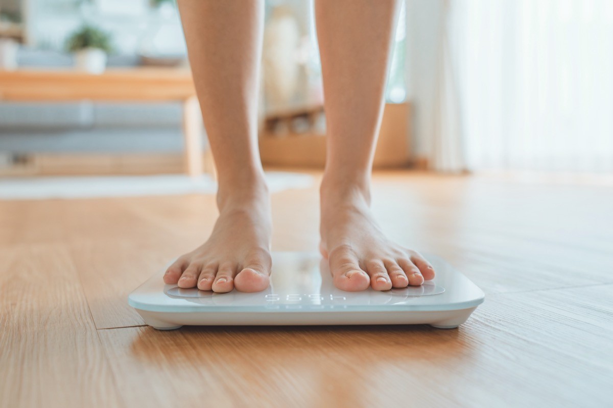 woman standing on scale