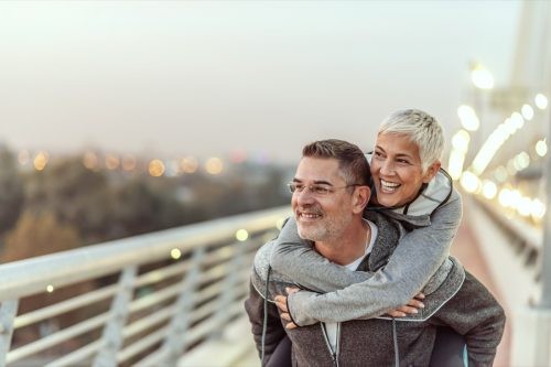 Photo of Happy mature couple having fun in the city on a autumn day