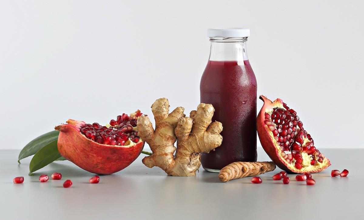 pomegranate juice, pomegranates, and ginger