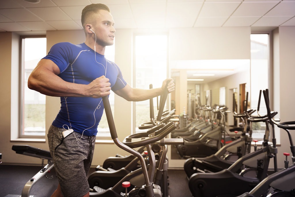 man on a treadmill in the gym cardio workouts for men over 40