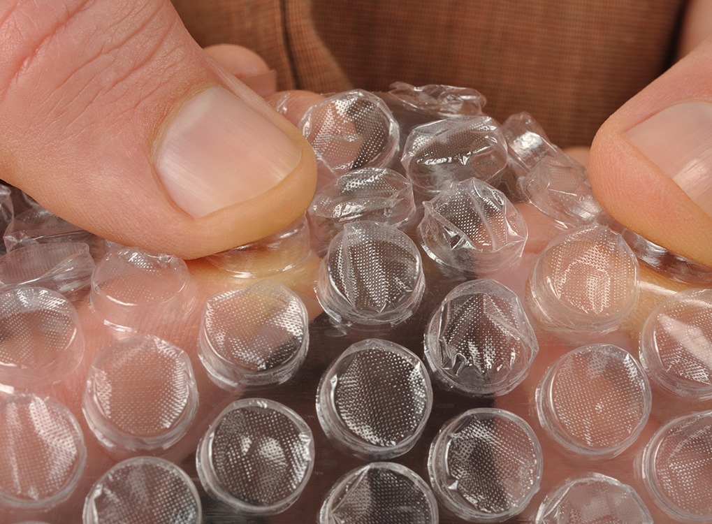 Person popping bubble rap